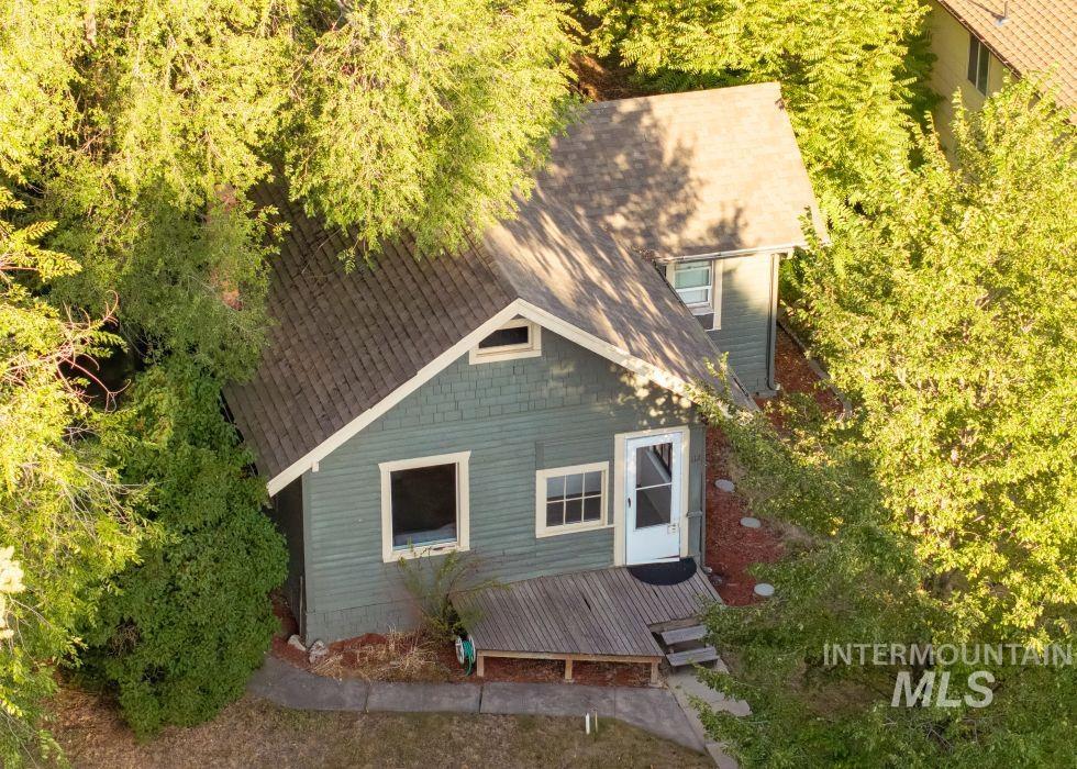 112 South Asbury Street Moscow, ID 83843 - Photo 4 of 26 Front of property featuring a wooden deck and a shingled roof