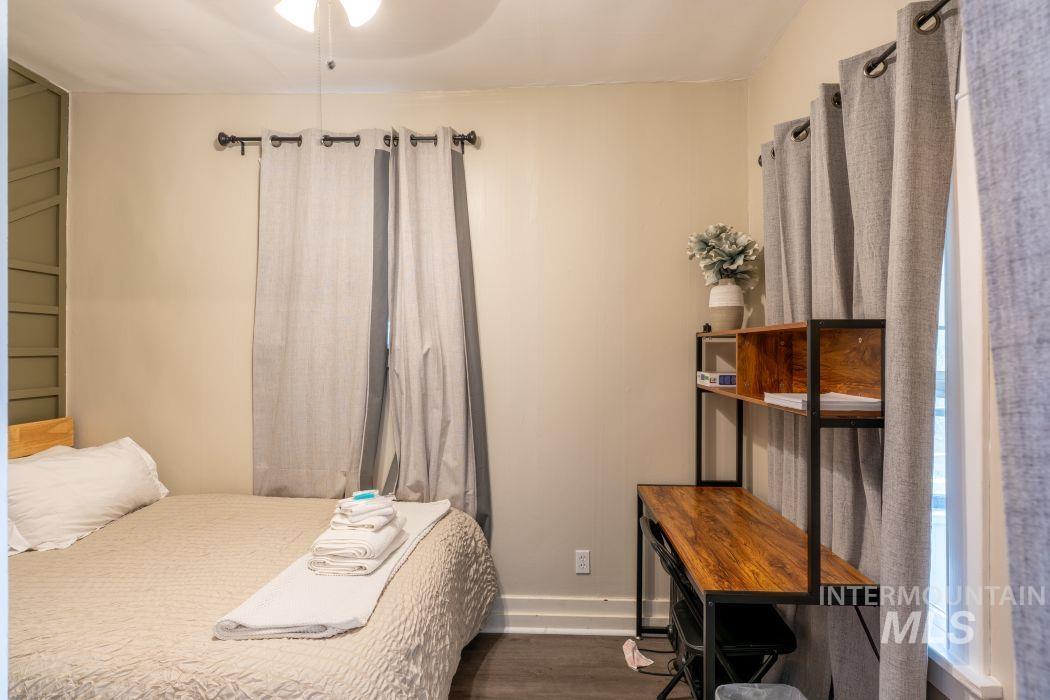 112 South Asbury Street Moscow, ID 83843 - Photo 8 of 26 Bedroom with baseboards and dark wood-style flooring