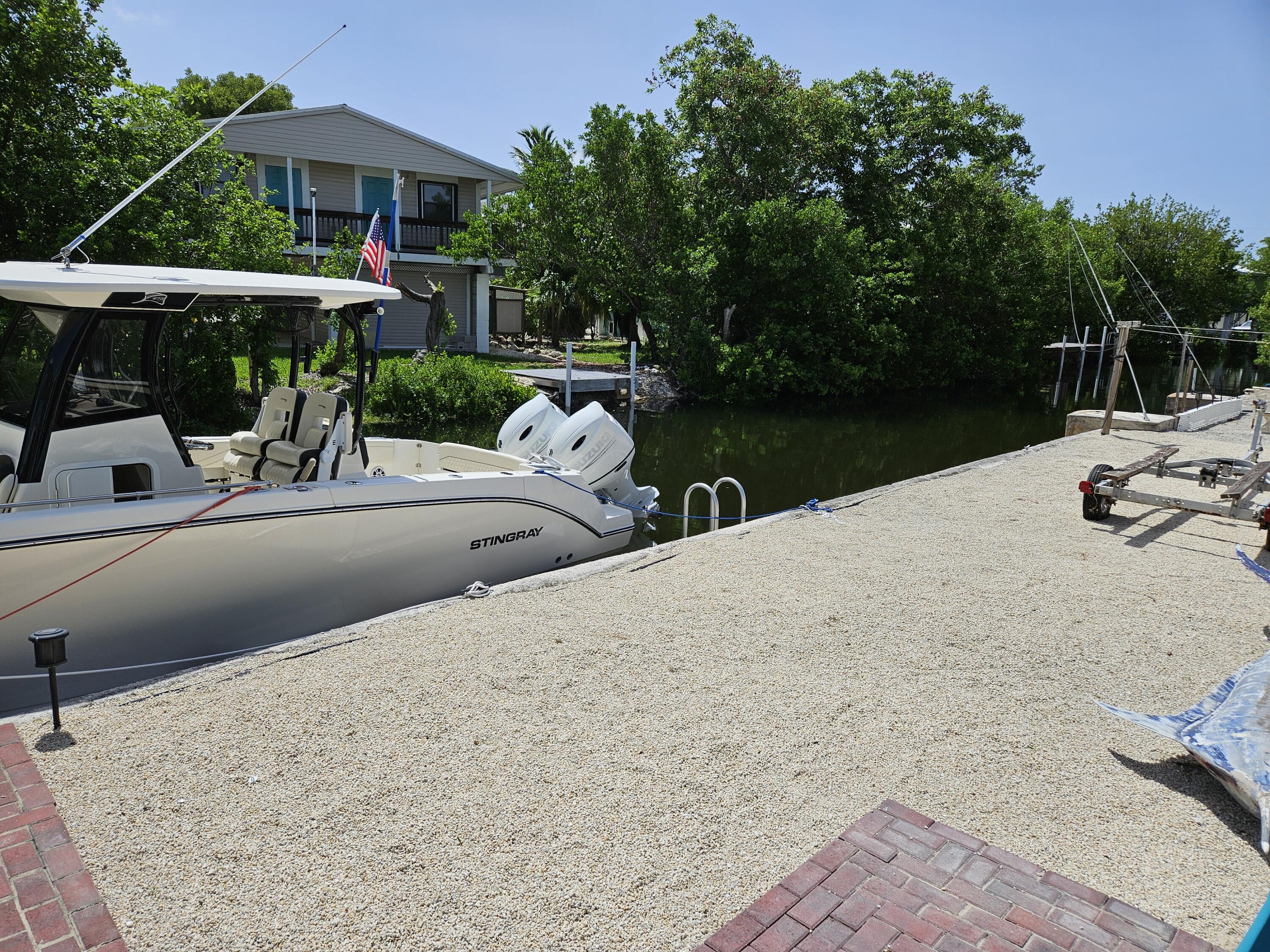 711 State Road, Unit 4A Summerland Key, FL 33042 - Photo 25 of 28 backyard and dock