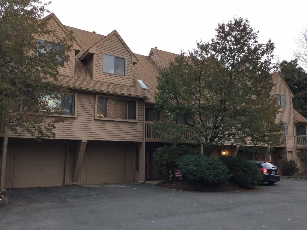 242 Talcottville Road, Unit 406 Vernon, CT 06066 - Photo 1 of 1 a front view of a house with a garden