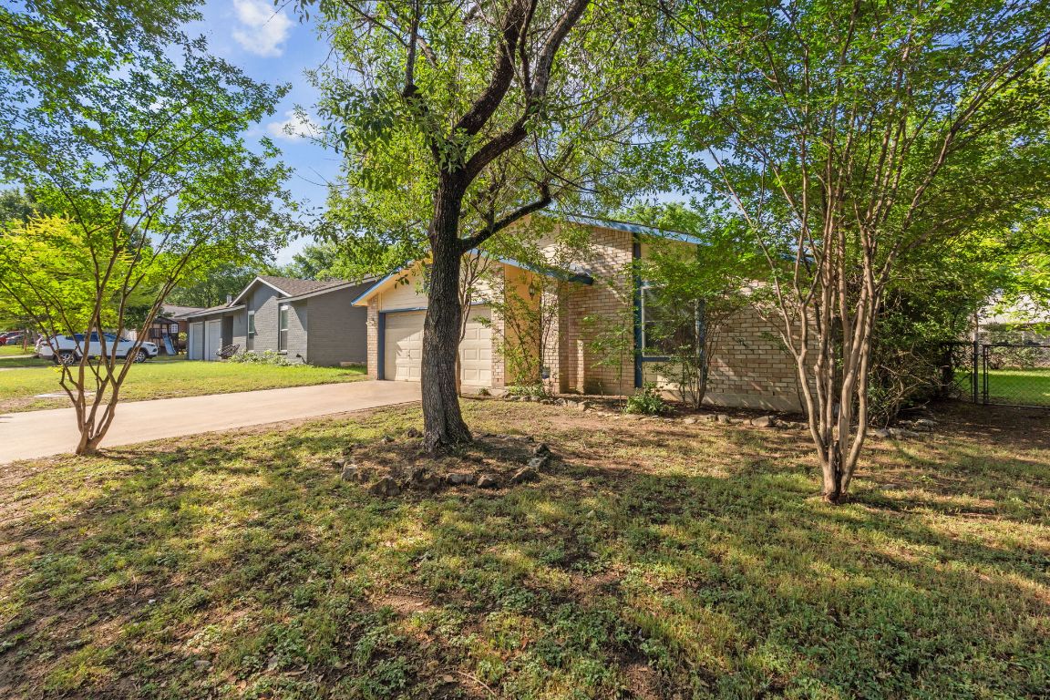 1213 Turtle Creek Boulevard Austin, TX 78745 - Photo 1 of 1 a view of a house with backyard and tree