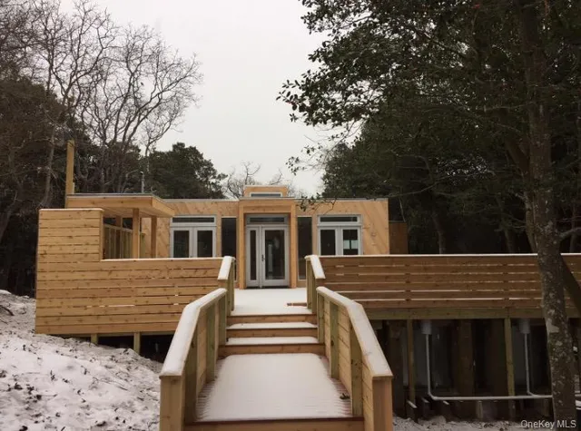 a view of a house with a backyard space