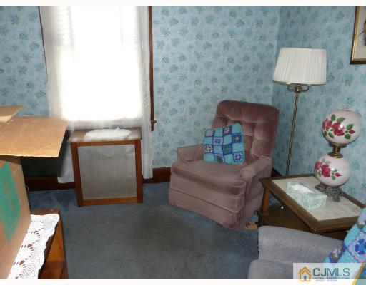 467 Crows Mill Road Fords, NJ 08863 - Photo 8 of 9 a living room with furniture and a lamp