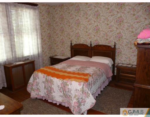 467 Crows Mill Road Fords, NJ 08863 - Photo 9 of 9 a bedroom with a bed and wooden floor