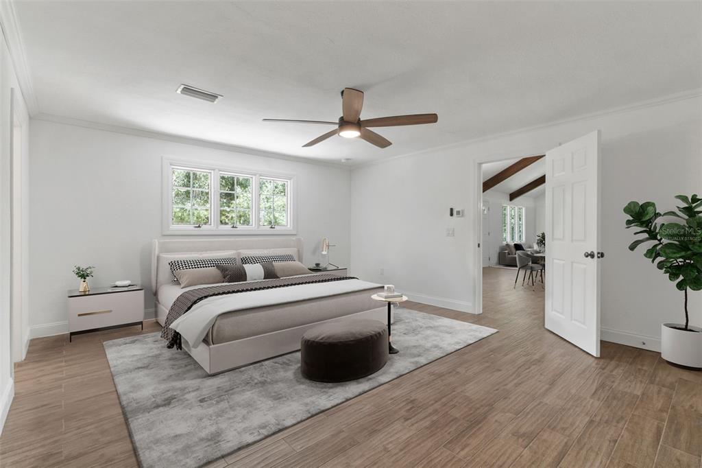 1183 Northwest Girl Scout Road Arcadia, FL 34266 - Photo 11 of 43 a bedroom with a bed and a chandelier