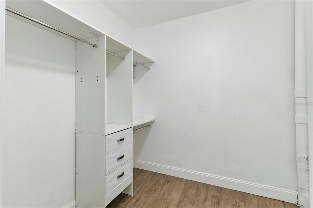 1183 Northwest Girl Scout Road Arcadia, FL 34266 - Photo 13 of 43 a view of walk in closet with empty racks
