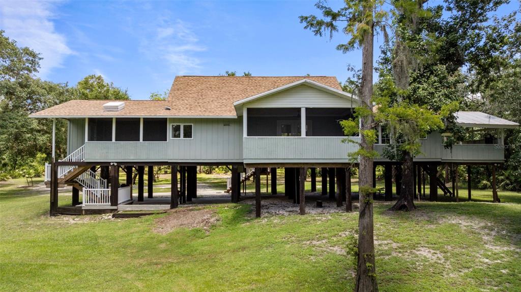 1183 Northwest Girl Scout Road Arcadia, FL 34266 - Photo 25 of 43 a front view of a house with garden