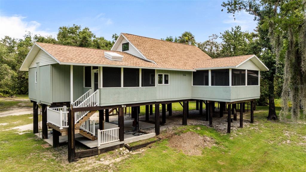 1183 Northwest Girl Scout Road Arcadia, FL 34266 - Photo 26 of 43 a view of a house with backyard and porch