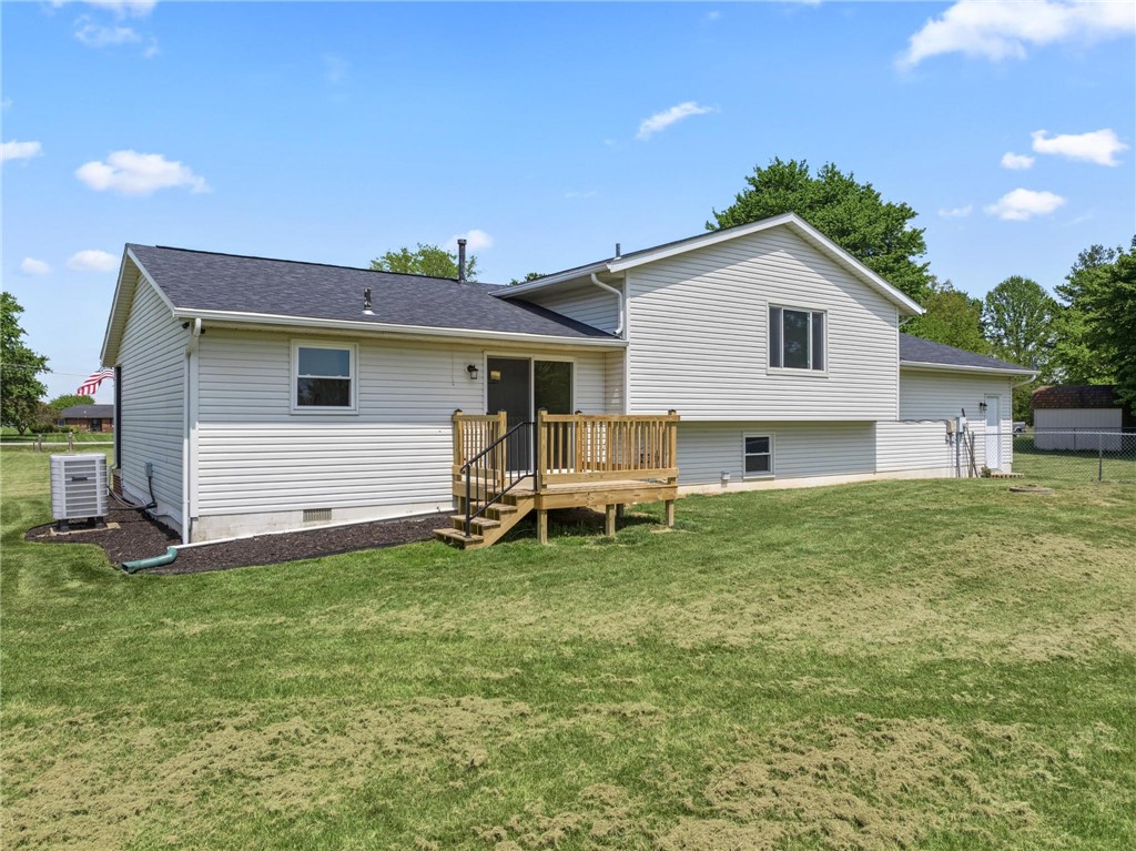 1353 Foust Road Xenia, OH 45385 - Photo 17 of 50 An inviting backyard with a wooden deck, perfect for outdoor living and entertaining.