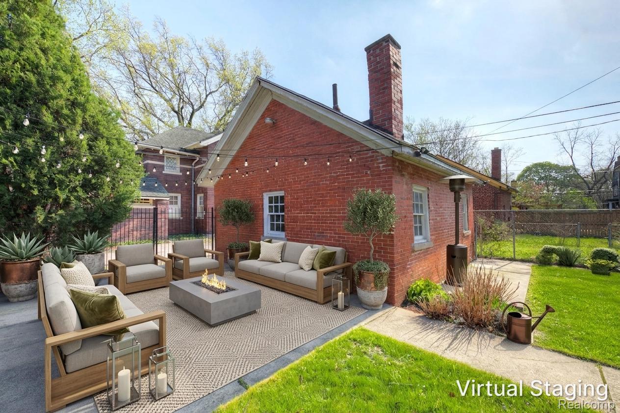 121 Longfellow Street Detroit, MI 48202 - Photo 54 of 87 Rear view of property with a patio area, brick siding, a chimney, and an outdoor living space with a fire pit