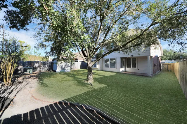 a backyard of a house with seating space