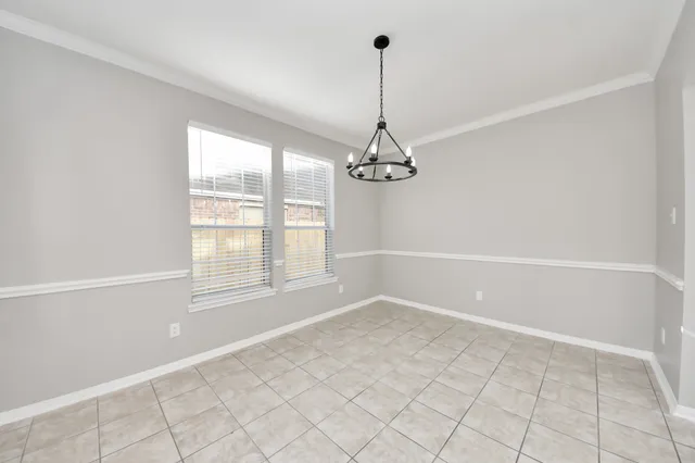 a view of empty room with windows