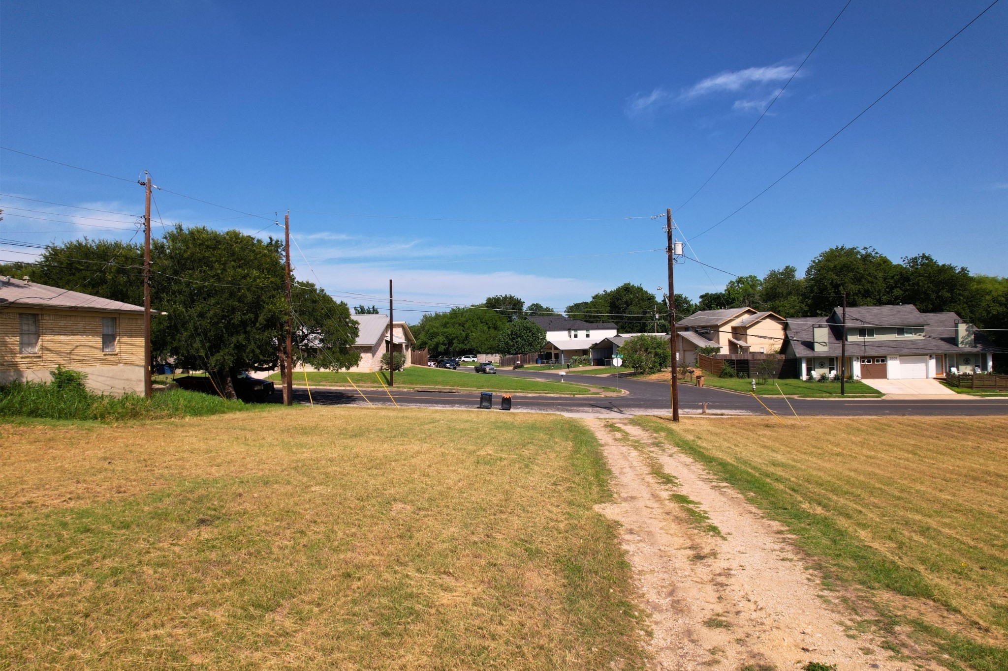 2610-2606 Metcalfe Road Austin, TX 78741 - Photo 9 of 20 A promising buildable lot within an established neighborhood, featuring a clear, ready-to-develop landscape.