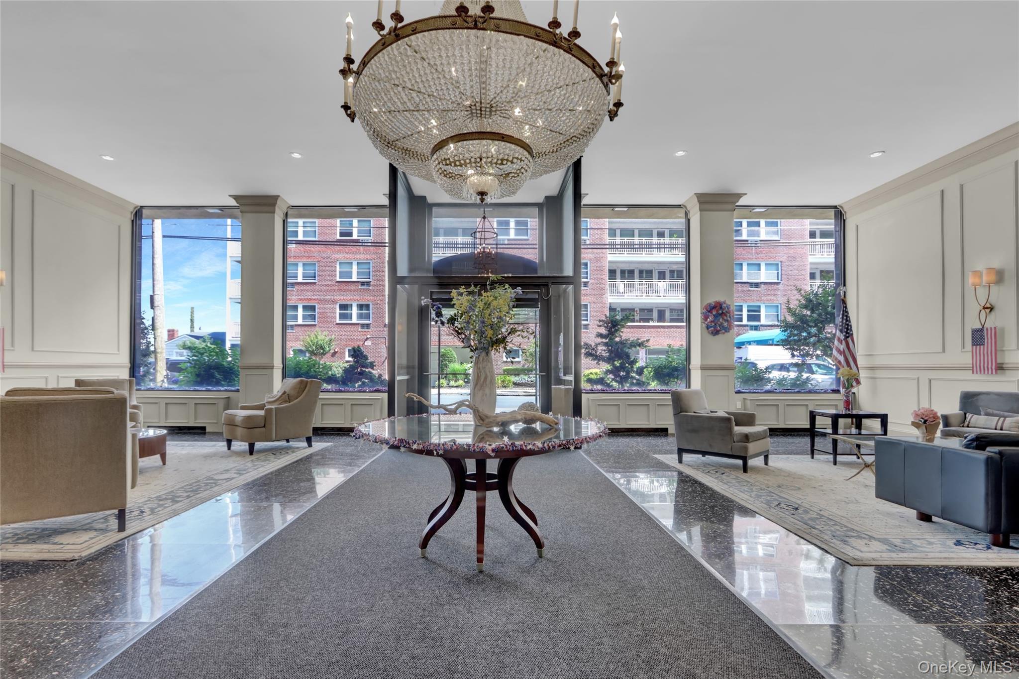 700 Shore Road, Unit 4K Long Beach, NY 11561 - Photo 32 of 32 Lobby with a decorative wall, a wall of windows, and recessed lighting