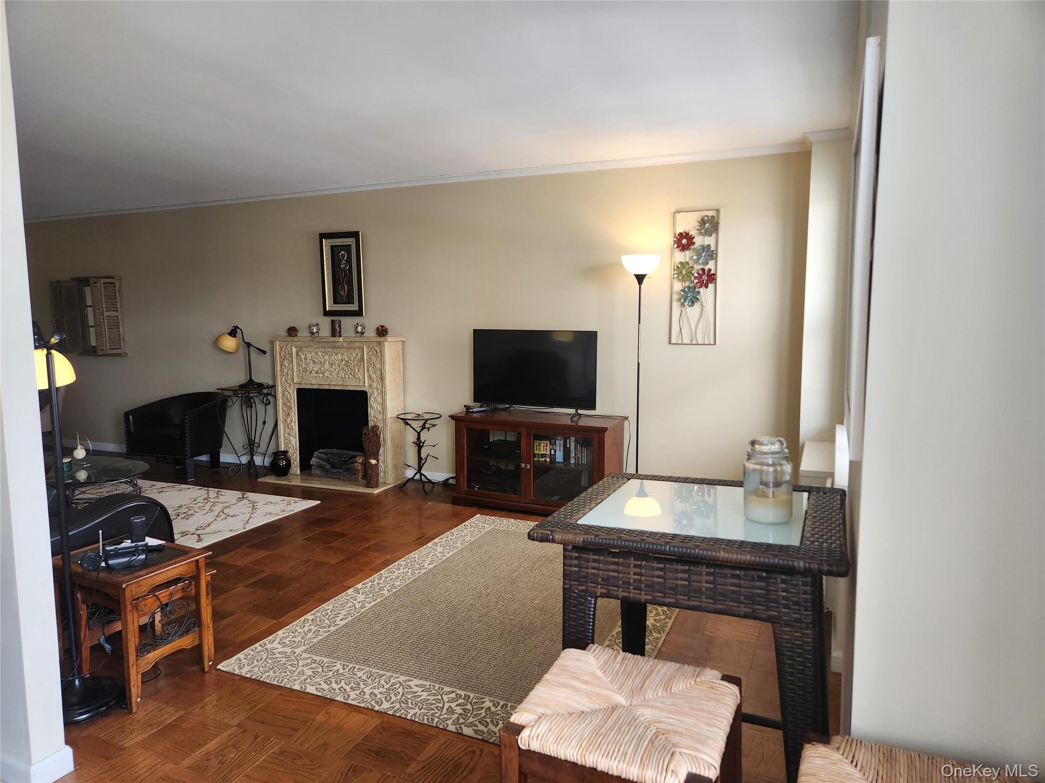 700 Shore Road, Unit 4K Long Beach, NY 11561 - Photo 7 of 32 Living room with crown molding.