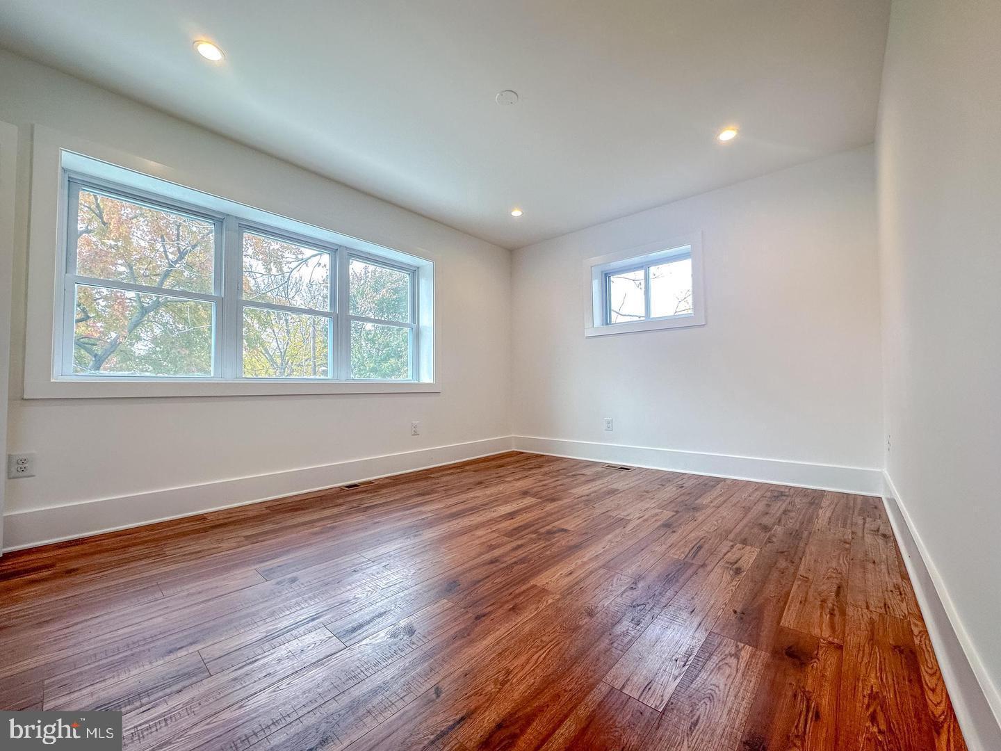 3326 12th Street Southeast Washington, DC 20032 - Photo 13 of 19 an empty room with wooden floor and windows