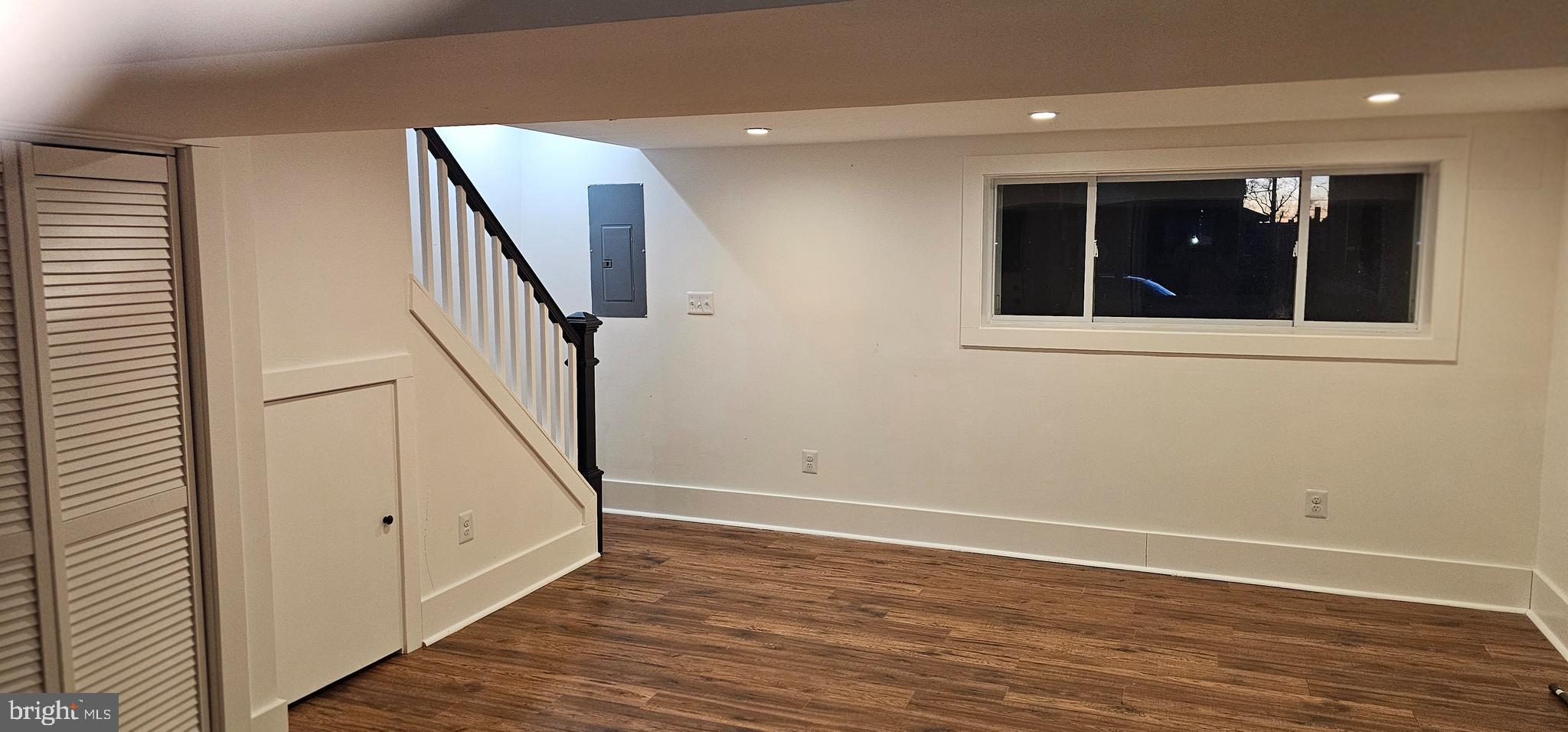 3326 12th Street Southeast Washington, DC 20032 - Photo 16 of 19 a view of a hallway with wooden floor and staircase