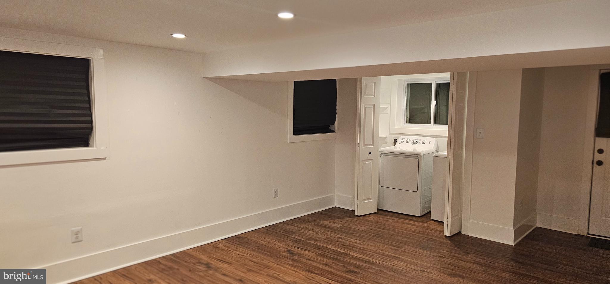 3326 12th Street Southeast Washington, DC 20032 - Photo 17 of 19 a view of an empty room with wooden floor and closet