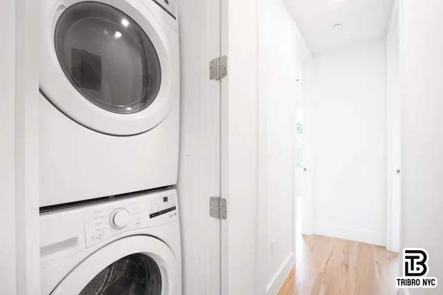 a close view of a utility room with dryer and washer