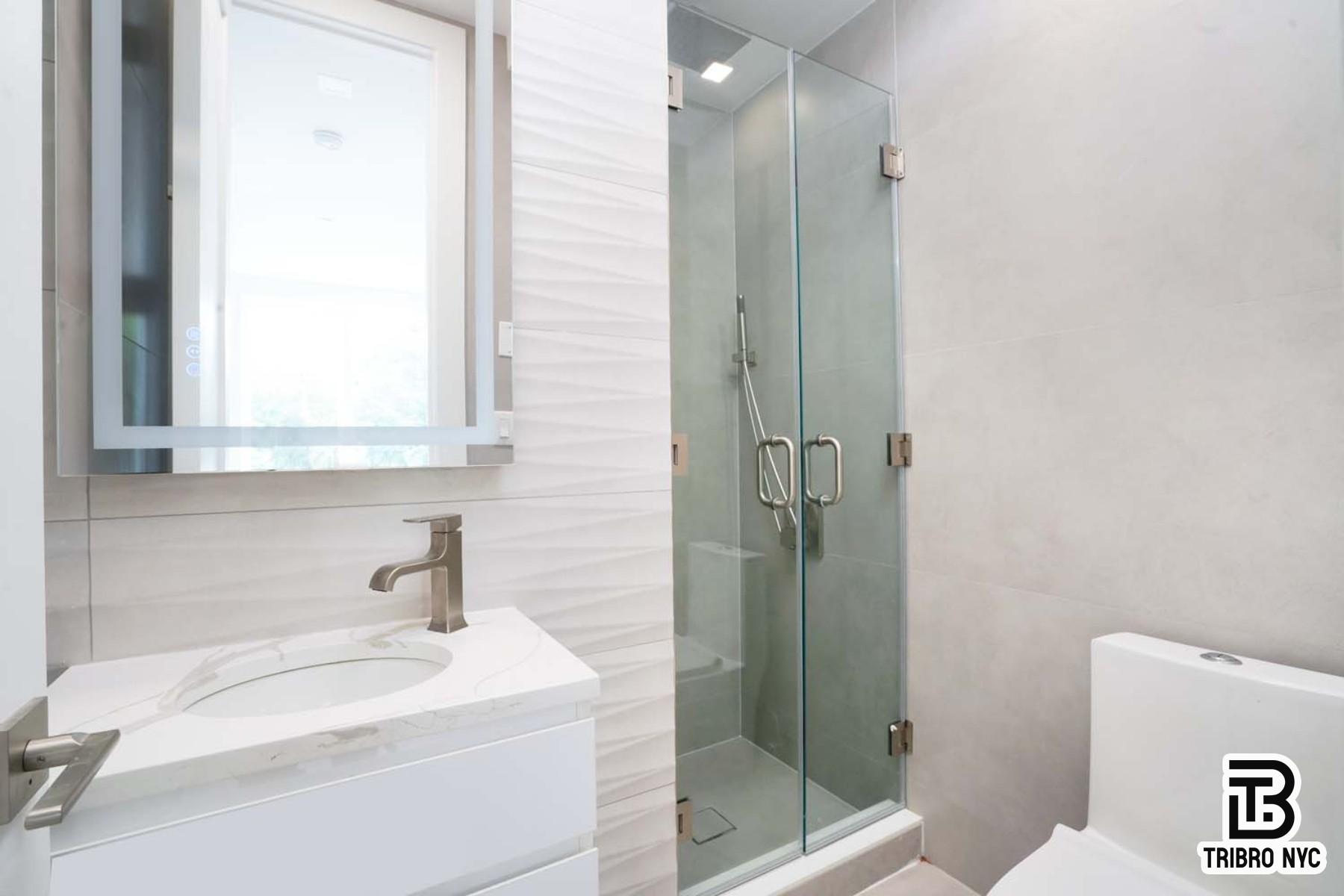 13 North Elliott Place, Unit 3 Brooklyn, NY 11205 - Photo 8 of 8 a bathroom with a sink a toilet and shower