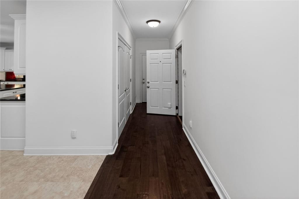 4113 Ledan Extension Gainesville, GA 30506 - Photo 91 of 195 a view of a hallway with wooden floor and a bathroom
