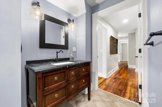 a kitchen with stainless steel appliances kitchen island granite countertop a stove a sink and a microwave