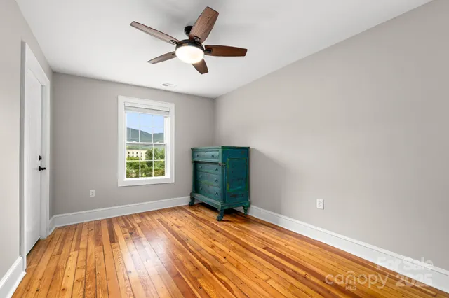 a view of a livingroom with furniture and staircase