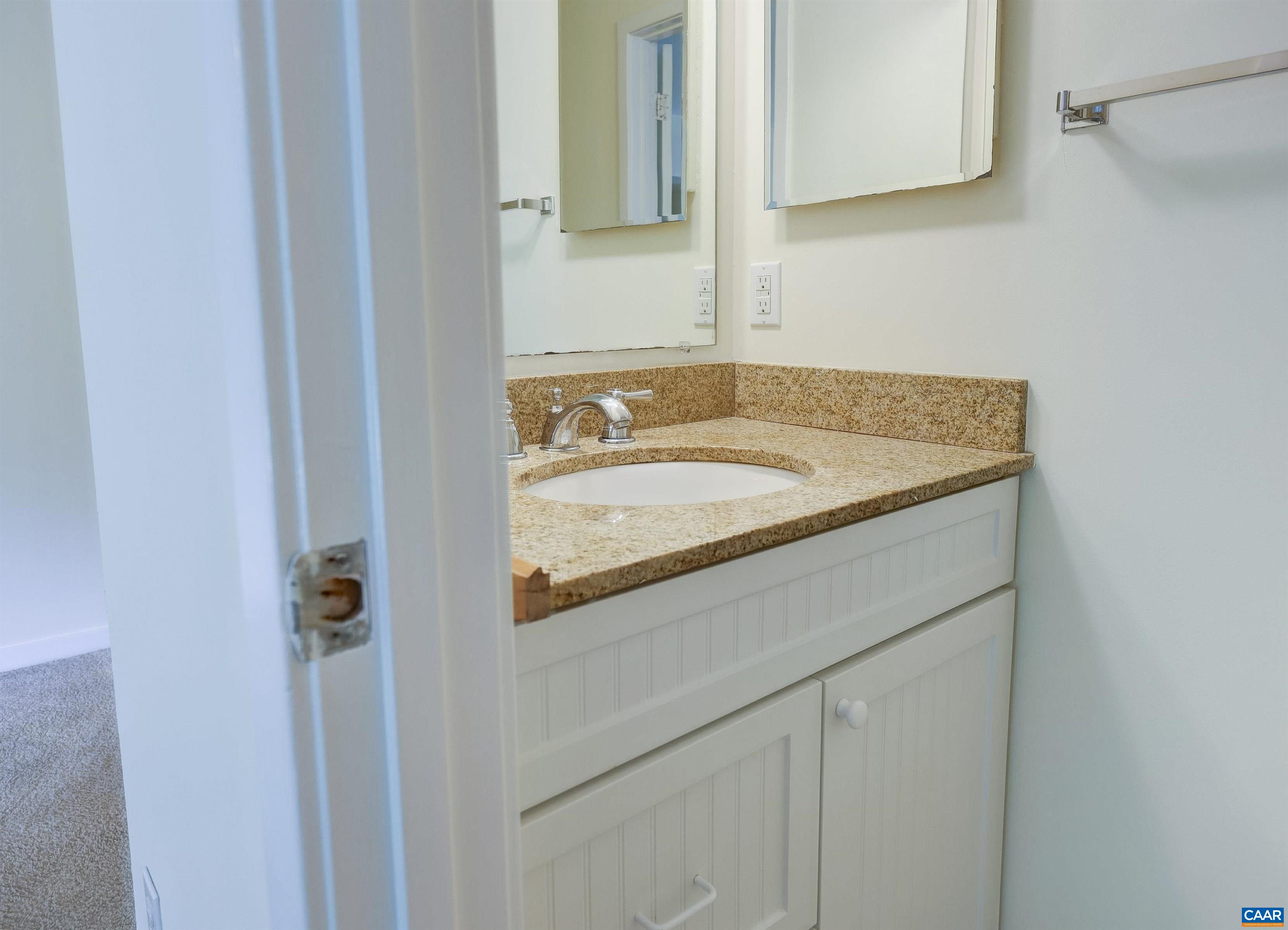 1296 Maple View Drive Charlottesville, VA 22902 - Photo 13 of 35 a bathroom with a sink and a mirror