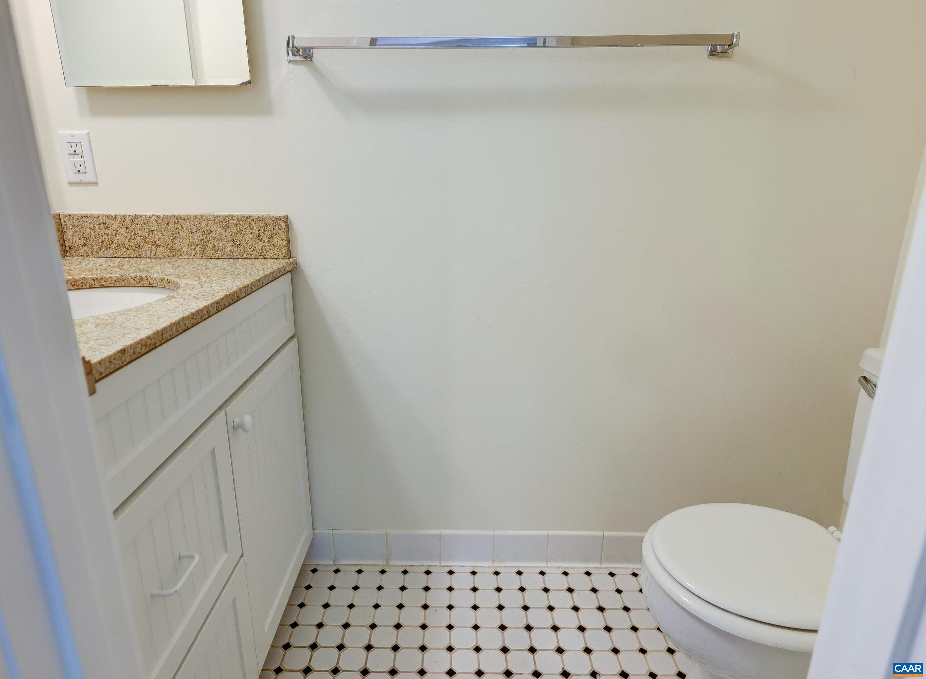 1296 Maple View Drive Charlottesville, VA 22902 - Photo 14 of 35 a bathroom with a granite countertop sink and a toilet