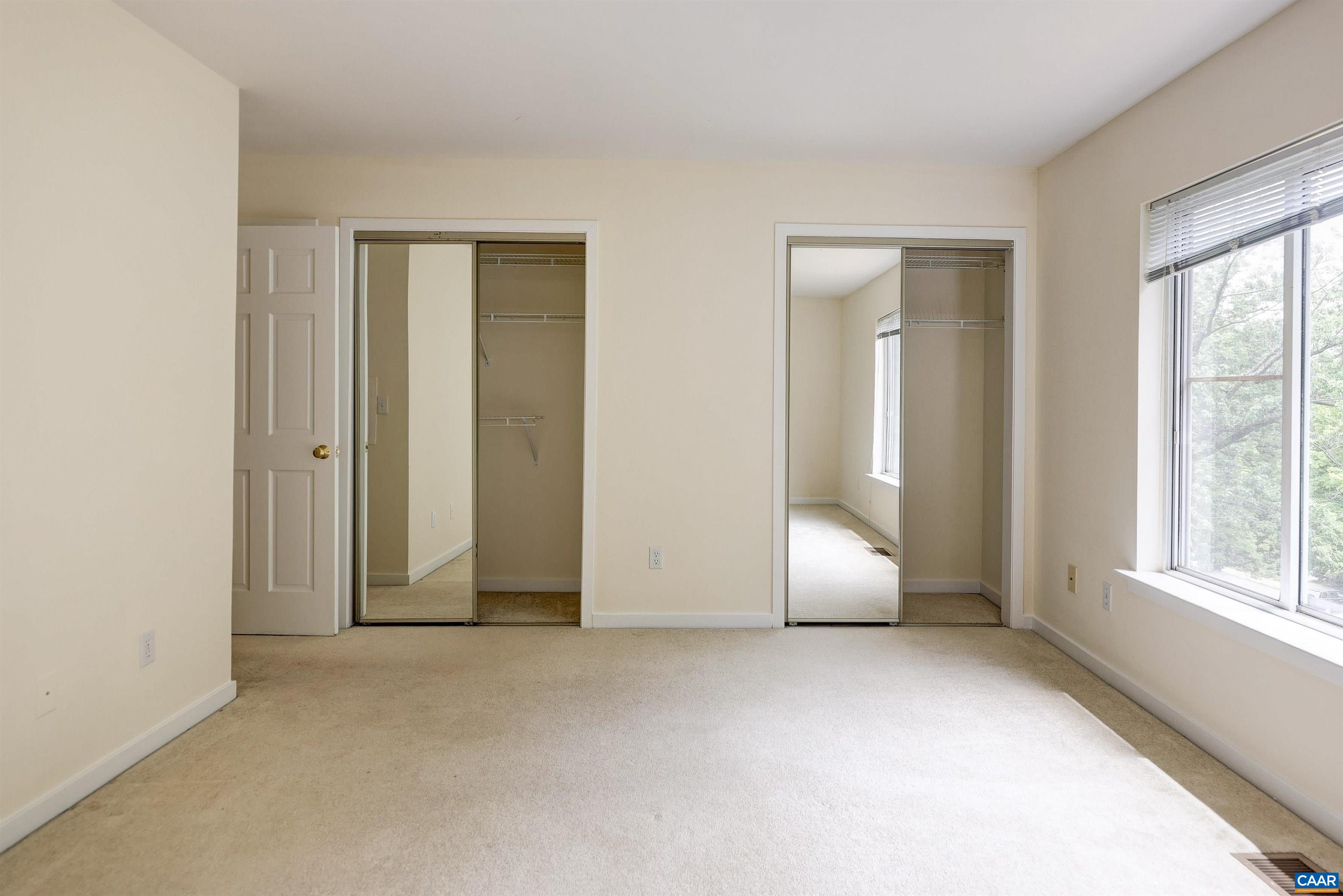 1296 Maple View Drive Charlottesville, VA 22902 - Photo 16 of 35 an empty room with windows and closet