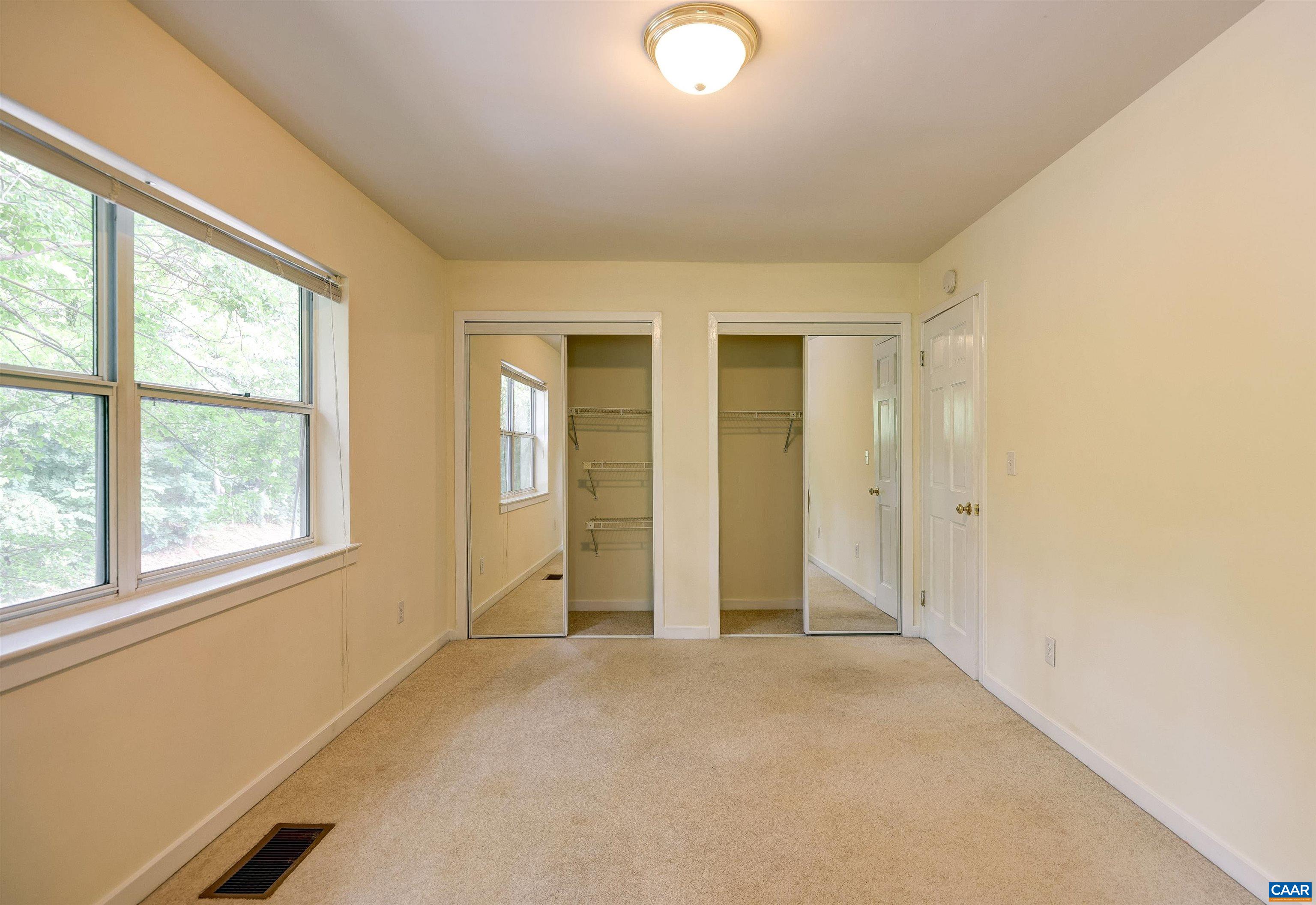 1296 Maple View Drive Charlottesville, VA 22902 - Photo 18 of 35 an empty room with windows