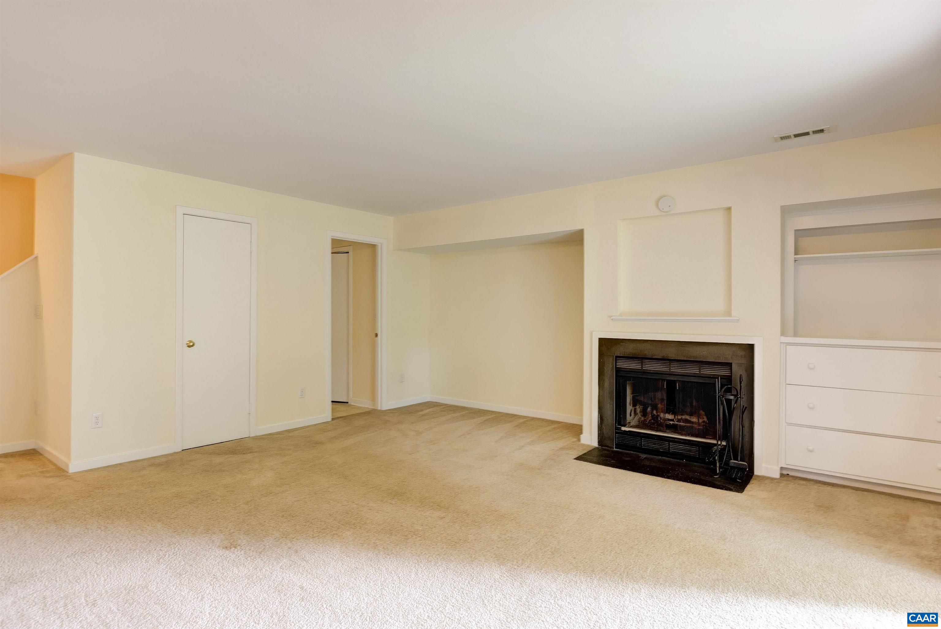 1296 Maple View Drive Charlottesville, VA 22902 - Photo 24 of 35 a view of empty room with a fireplace