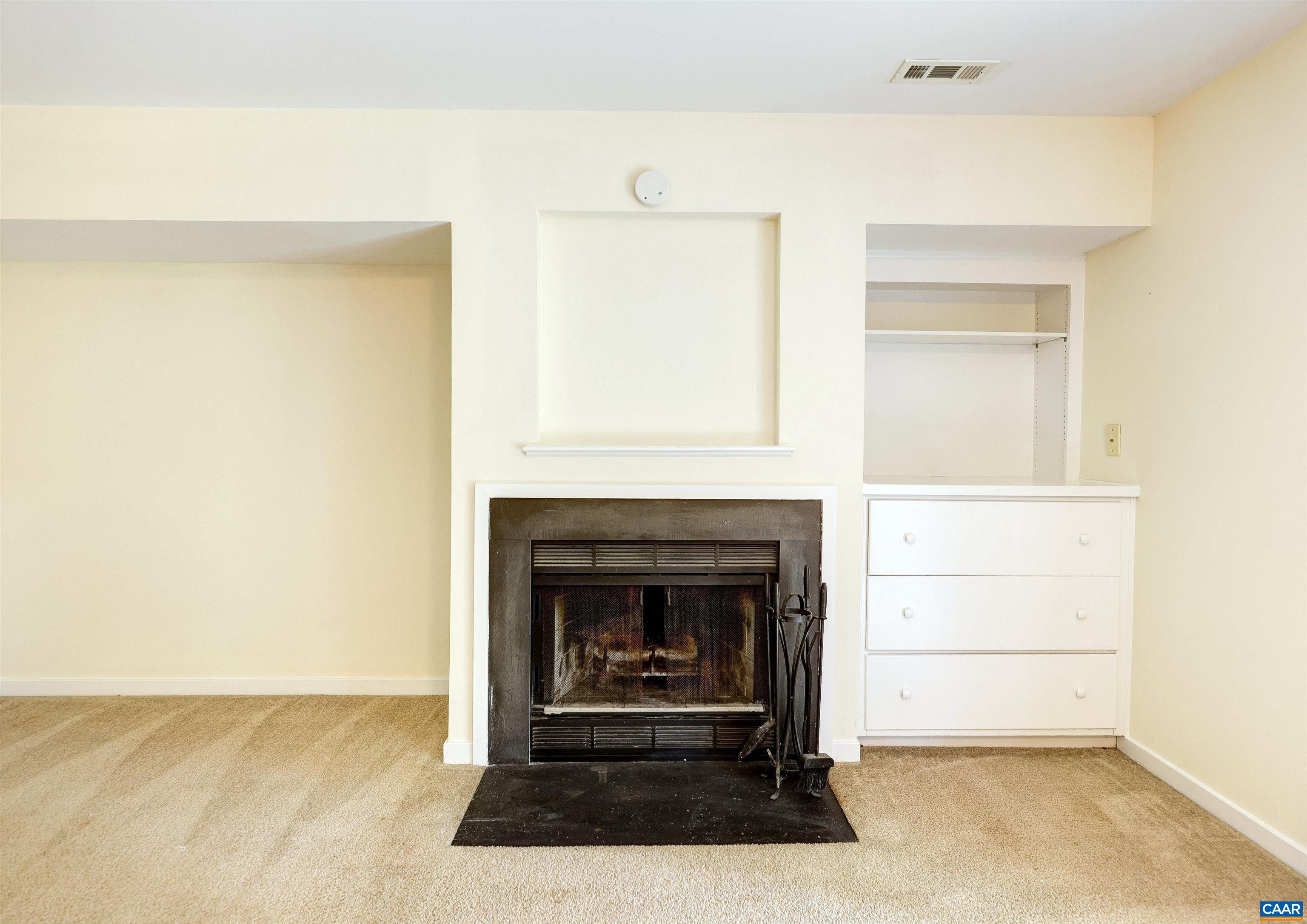 1296 Maple View Drive Charlottesville, VA 22902 - Photo 25 of 35 a living room with a fireplace