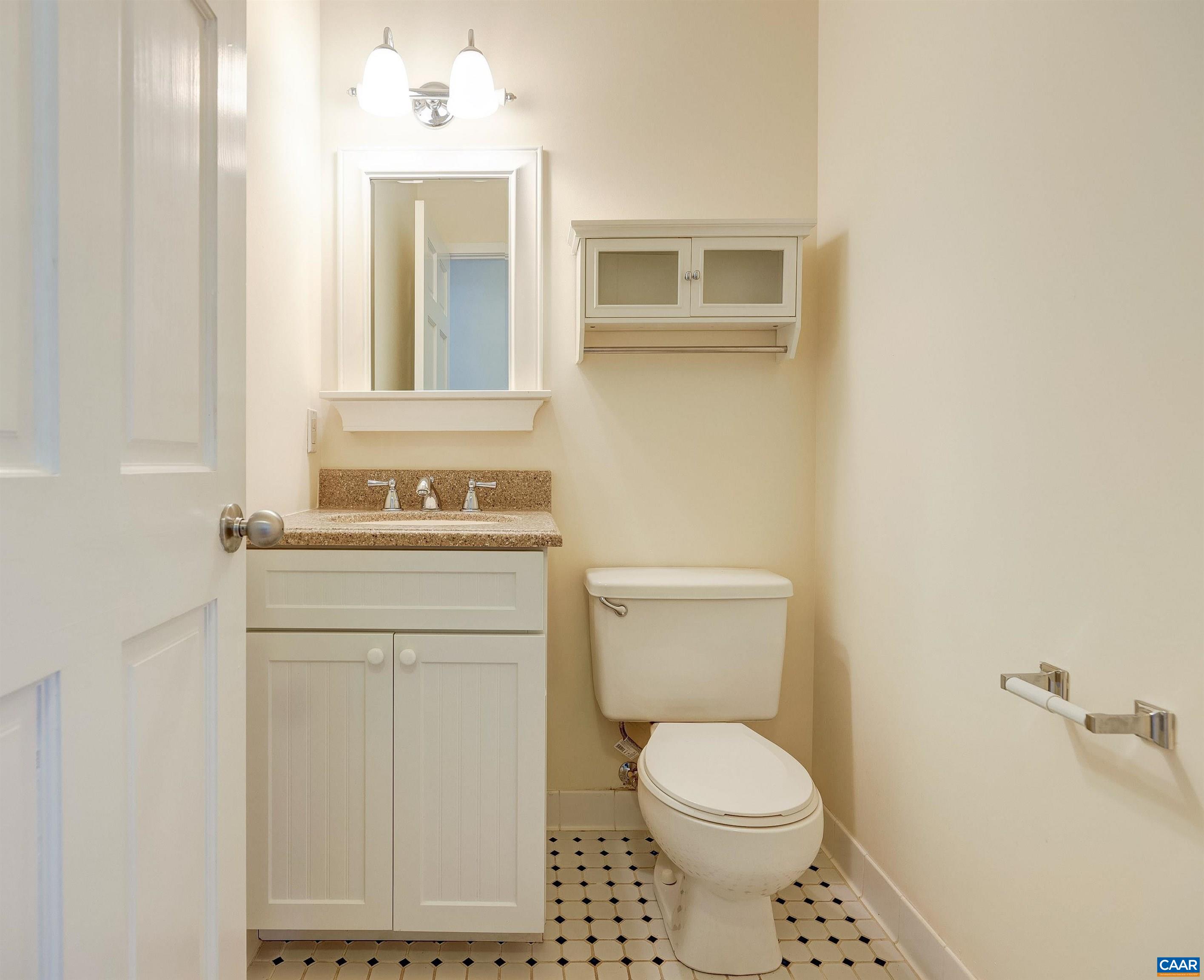 1296 Maple View Drive Charlottesville, VA 22902 - Photo 28 of 35 a bathroom with a toilet sink and mirror