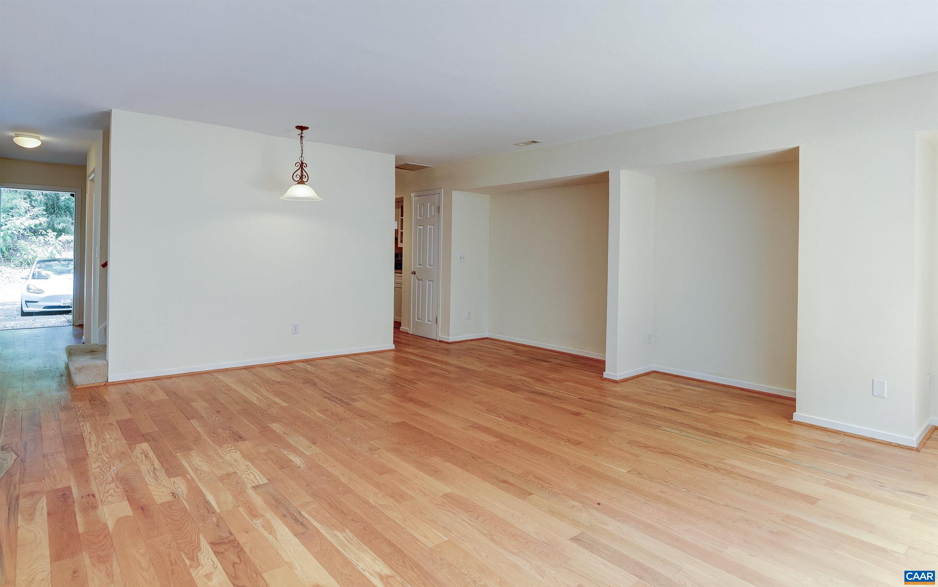 1296 Maple View Drive Charlottesville, VA 22902 - Photo 4 of 35 a view of empty room with wooden floor and fan