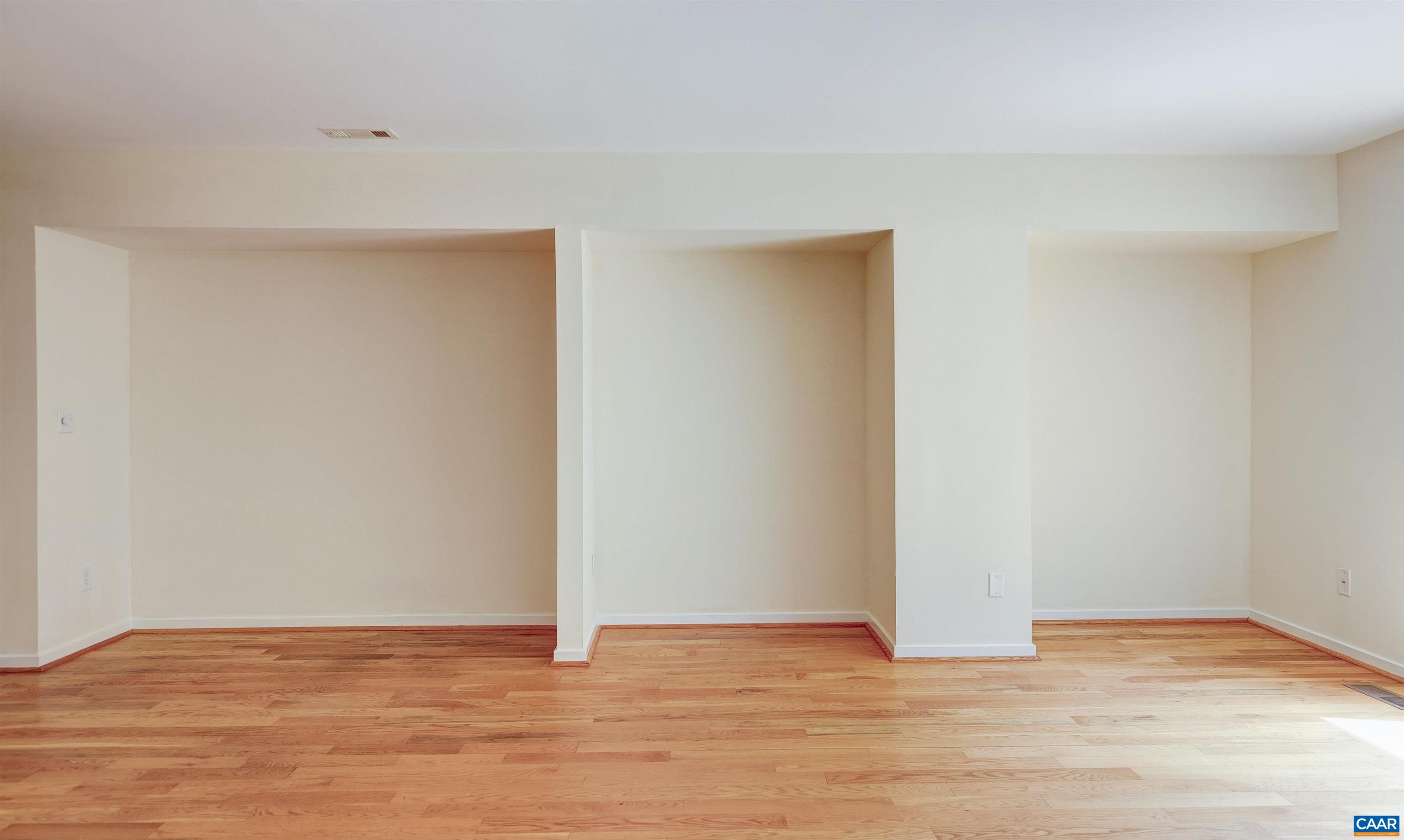 1296 Maple View Drive Charlottesville, VA 22902 - Photo 5 of 35 a view of an empty room with wooden floor and closet