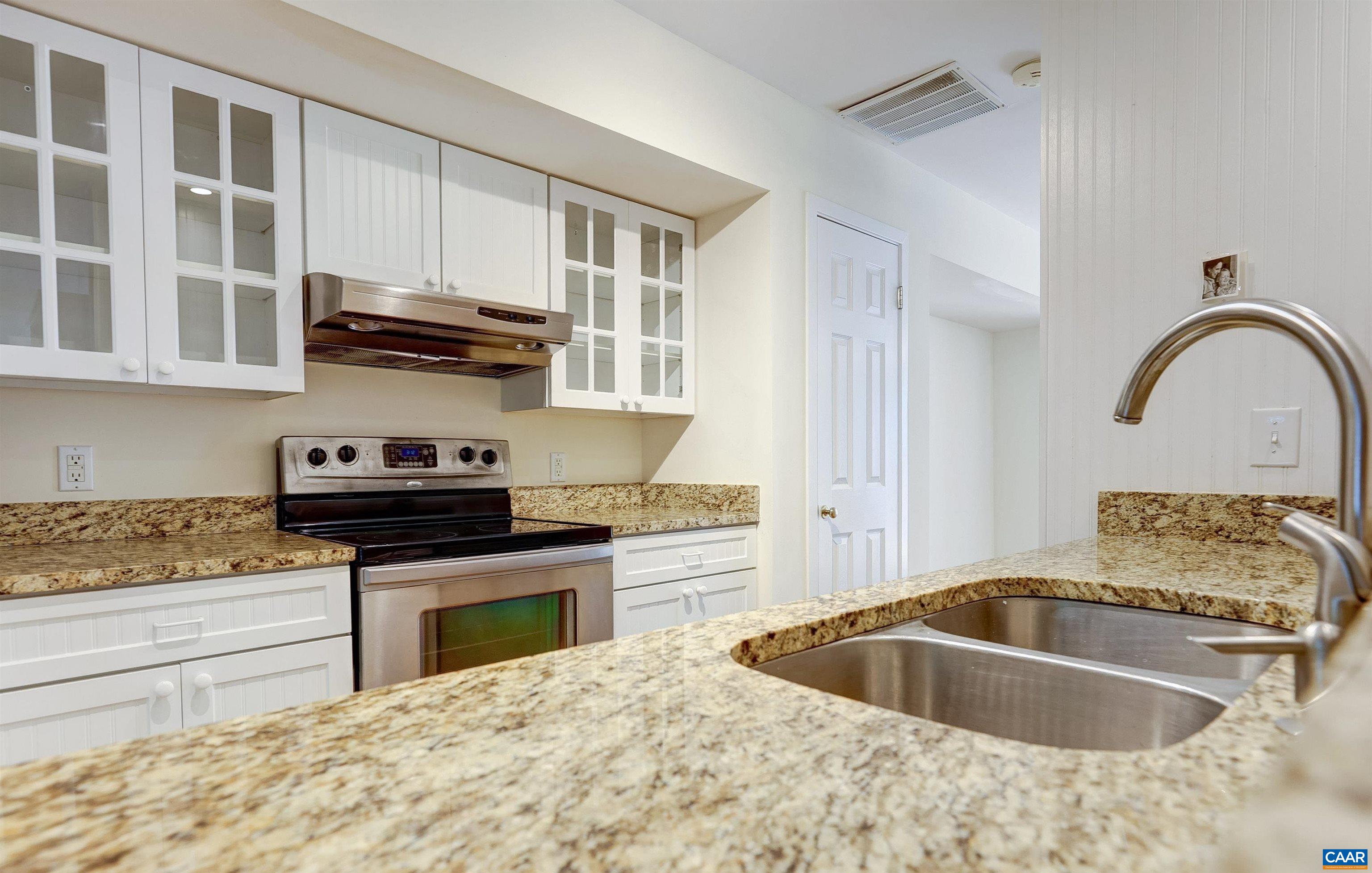 1296 Maple View Drive Charlottesville, VA 22902 - Photo 7 of 35 a kitchen with stainless steel appliances granite countertop a sink and cabinets