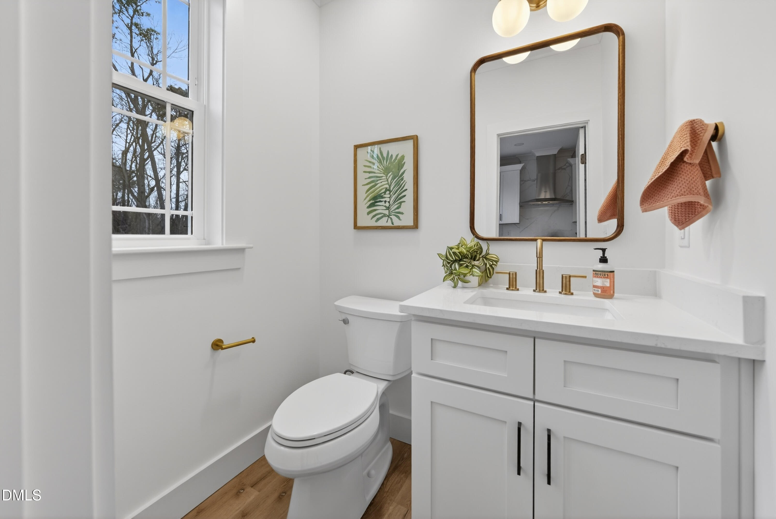 2940 Chapel Hill Road, Unit D Durham, NC 27707 - Photo 12 of 39 a bathroom with a toilet a sink and mirror