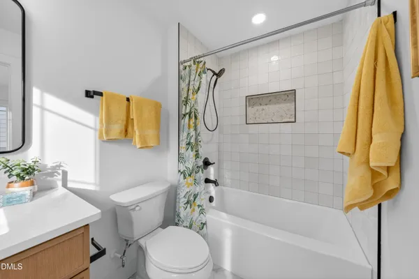 a bathroom with a toilet sink and tub