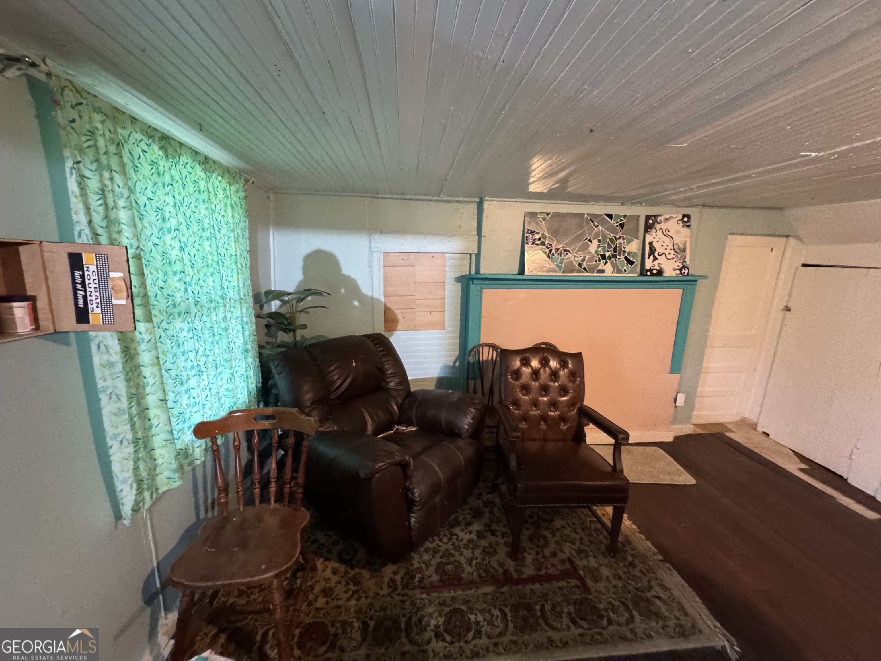 9122 Blue Ridge Highway Blairsville, GA 30512 - Photo 22 of 42 a living room with furniture rug and a large window