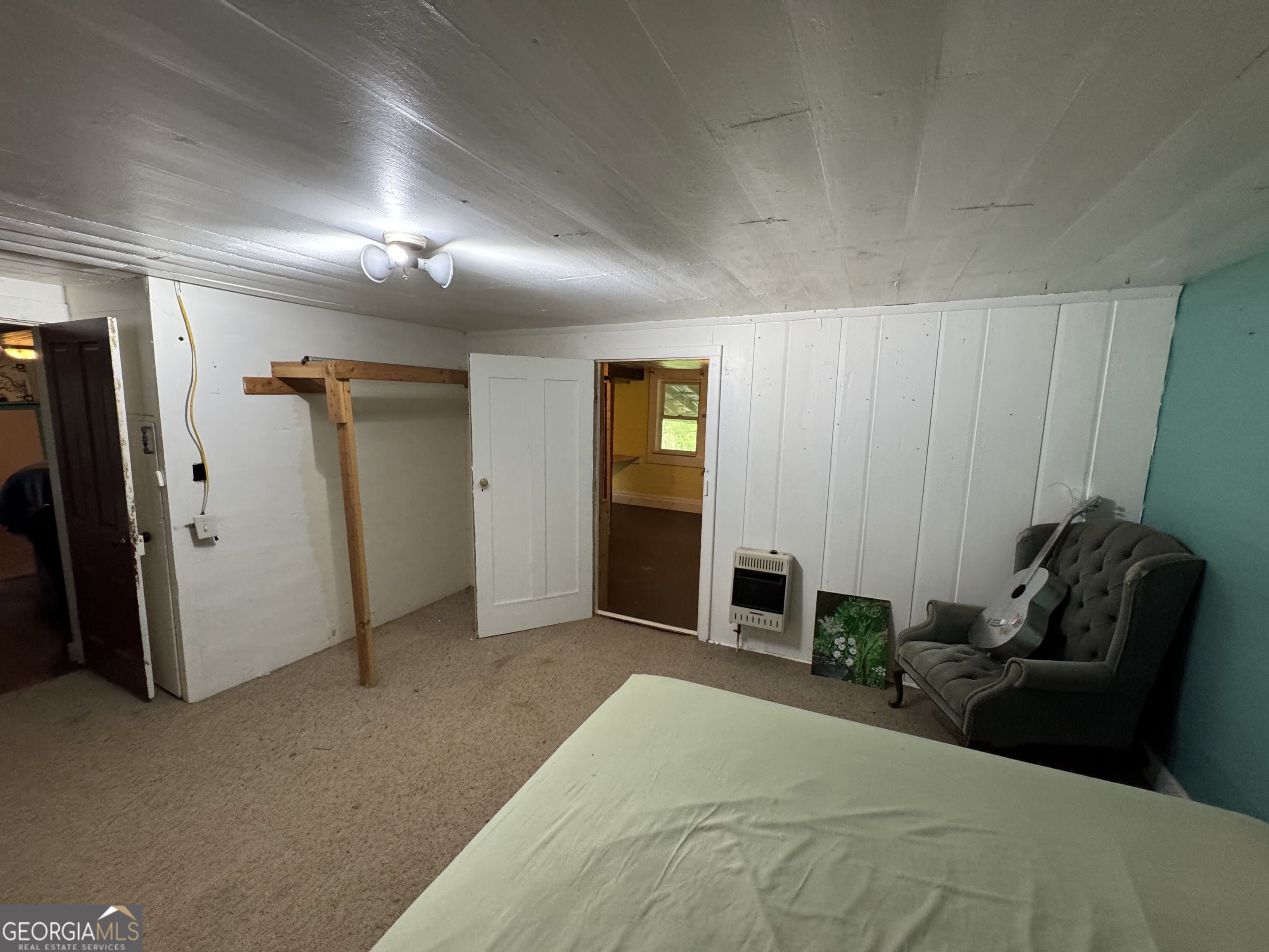 9122 Blue Ridge Highway Blairsville, GA 30512 - Photo 24 of 42 a bedroom with furniture and closet