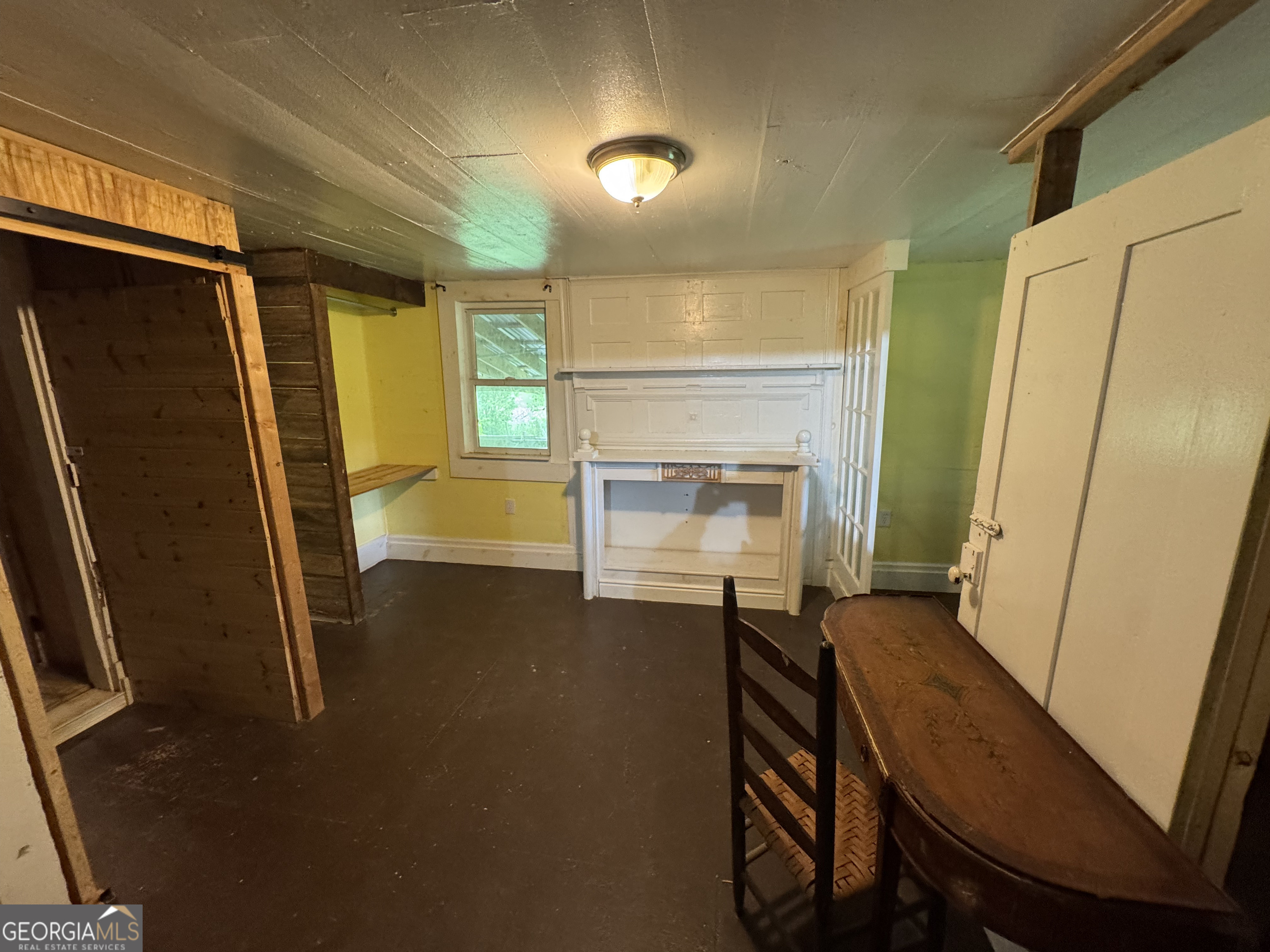 9122 Blue Ridge Highway Blairsville, GA 30512 - Photo 25 of 42 a view of kitchen with furniture and a fireplace