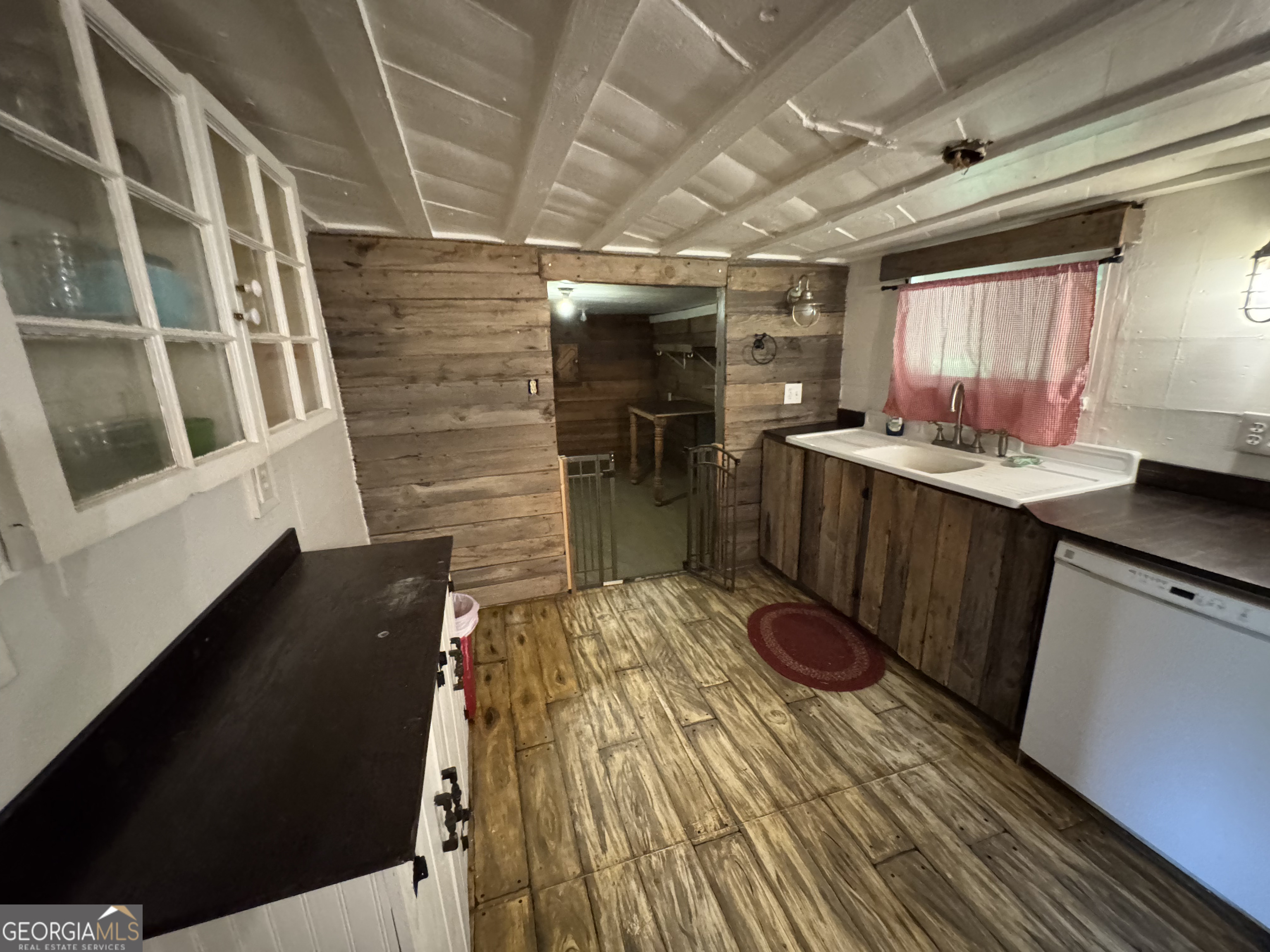 9122 Blue Ridge Highway Blairsville, GA 30512 - Photo 29 of 42 a kitchen with a sink and wooden floor