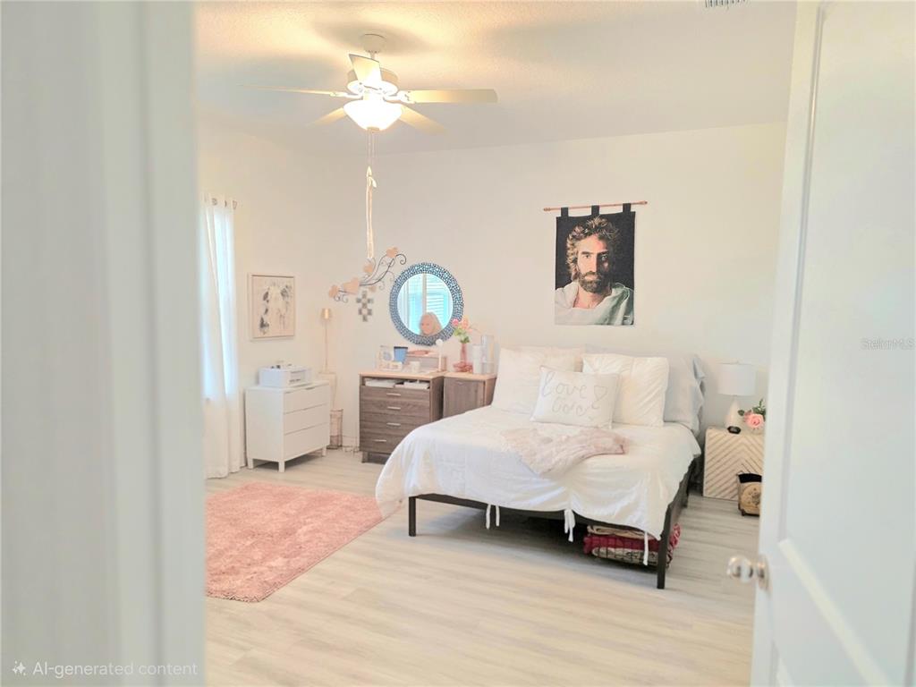 7875 Southwest 74th Street Ocala, FL 34474 - Photo 26 of 28 a living room with a bed furniture and a window