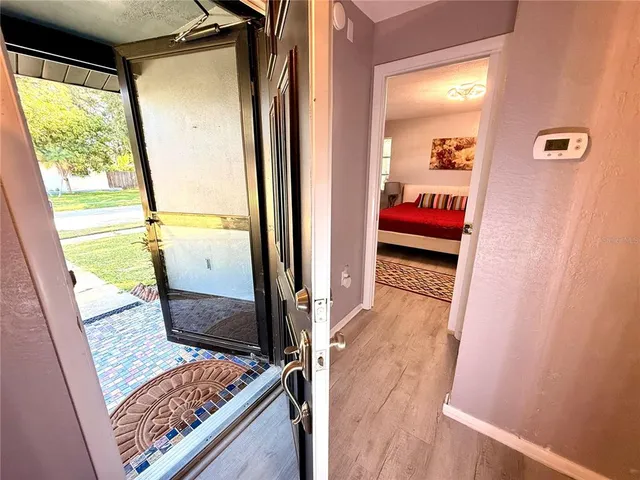 a living room with a flat screen tv and a couch