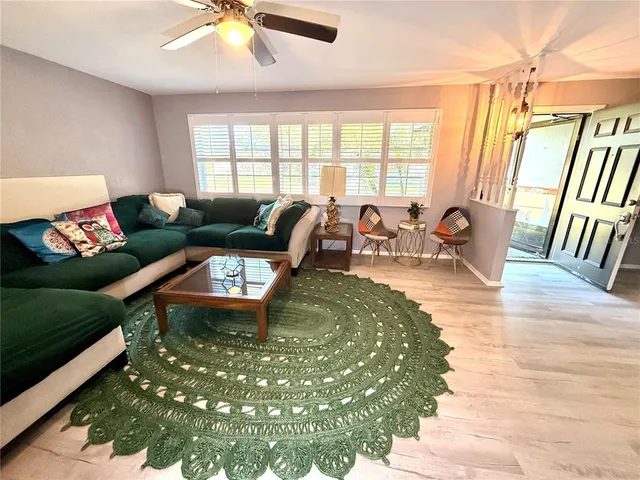 a bed room with a bed window and mirror