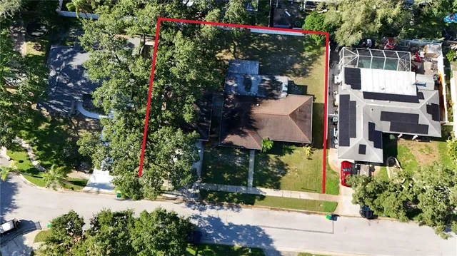 an aerial view of a city and mountain view in back