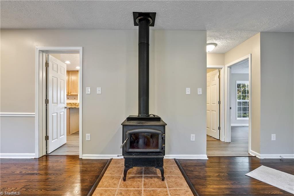 1025 Krishna Road Sandy Ridge, NC 27046 - Photo 11 of 50 Wood Stove in the Living Room