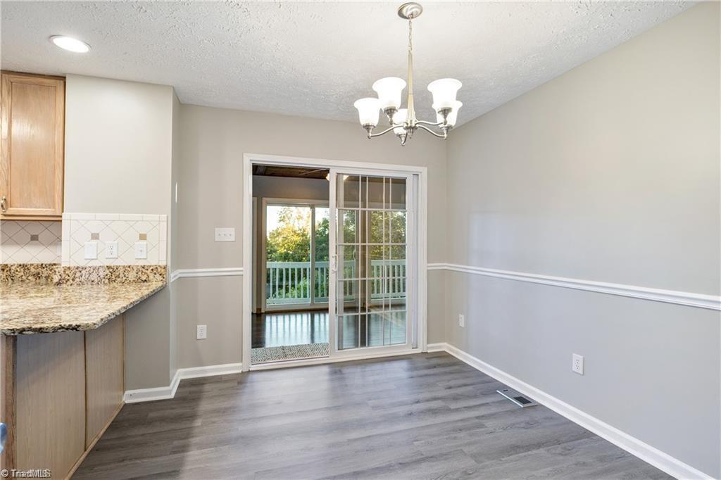 1025 Krishna Road Sandy Ridge, NC 27046 - Photo 17 of 50 Dining Room to the Sunroom
