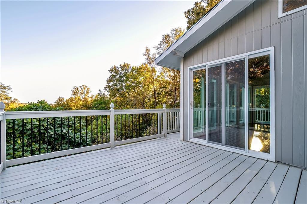 1025 Krishna Road Sandy Ridge, NC 27046 - Photo 21 of 50 Deck off of the Sunroom